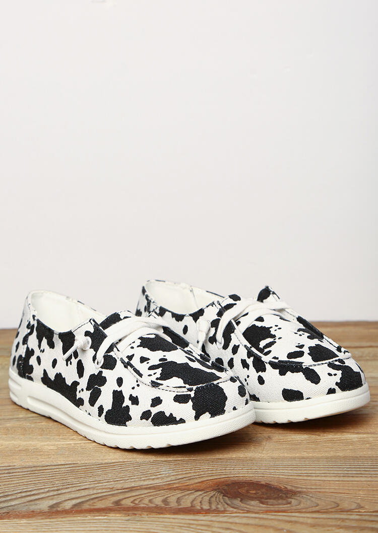 cow print slip on sneakers